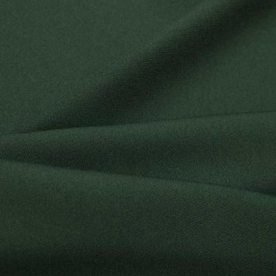 Ткань костюмная 21010 2076, 225 гр/м2, шир.150см, цвет т.зеленый - купить в Зеленодольске. Цена 390.73 руб.